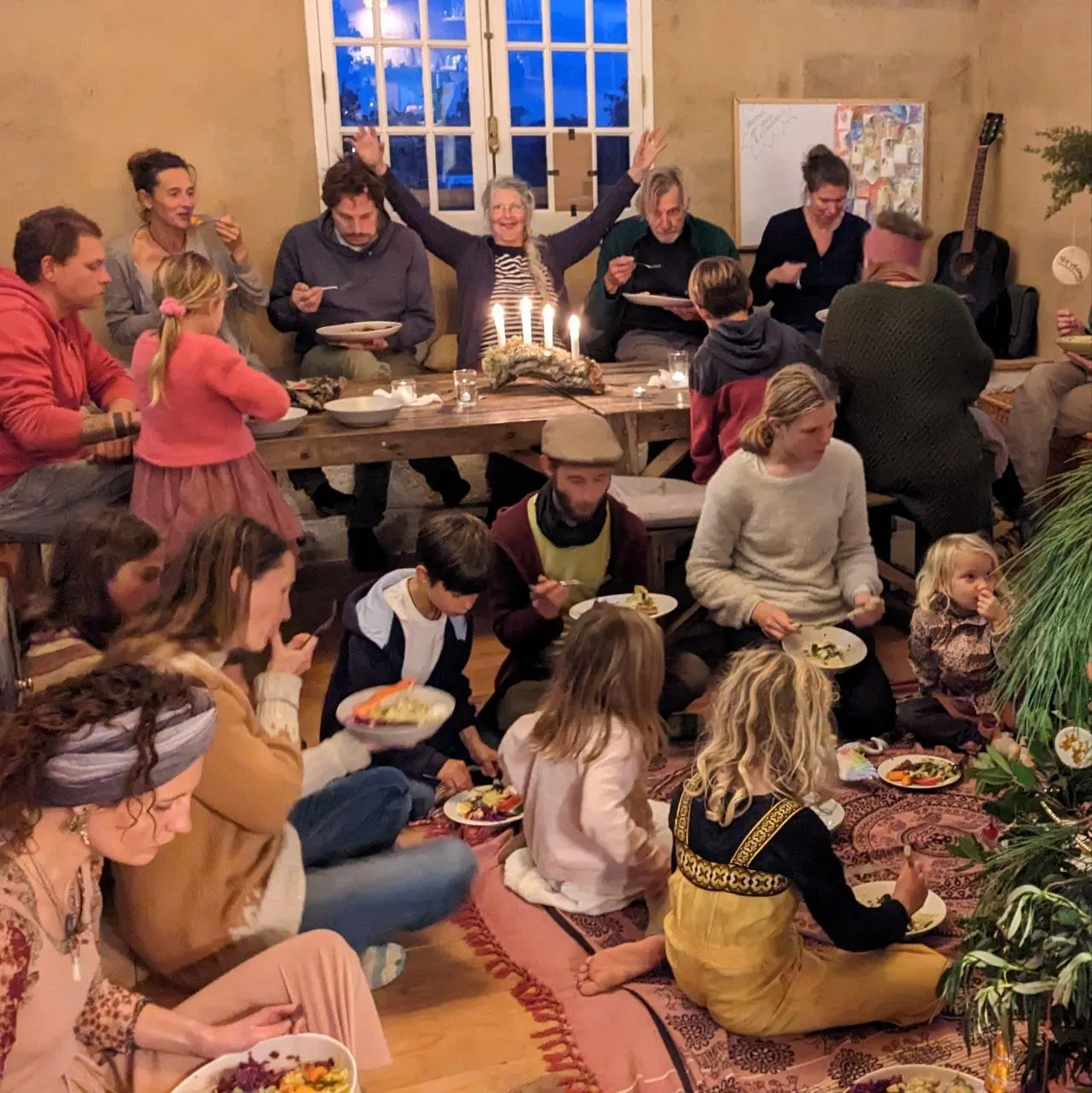 A shared meal in the Malama community house