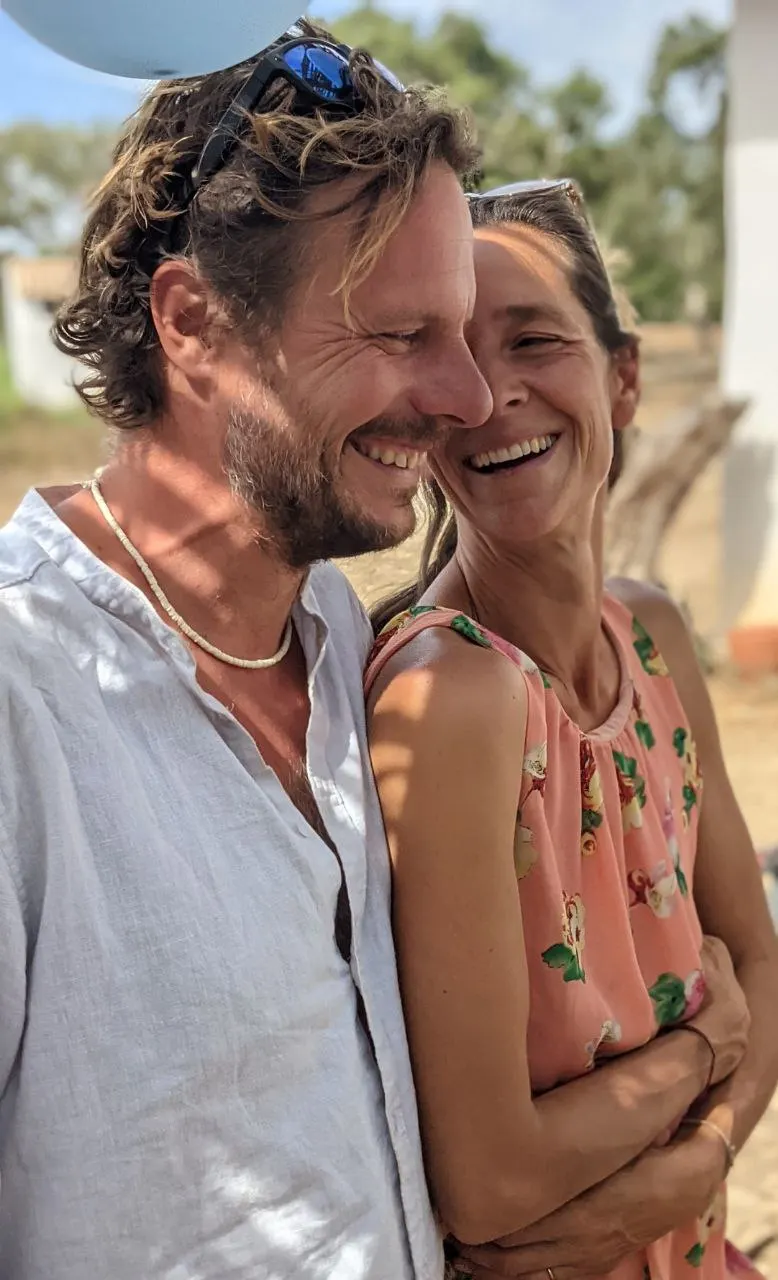 Susanne and Nico laughing together in the sunshine at Malama